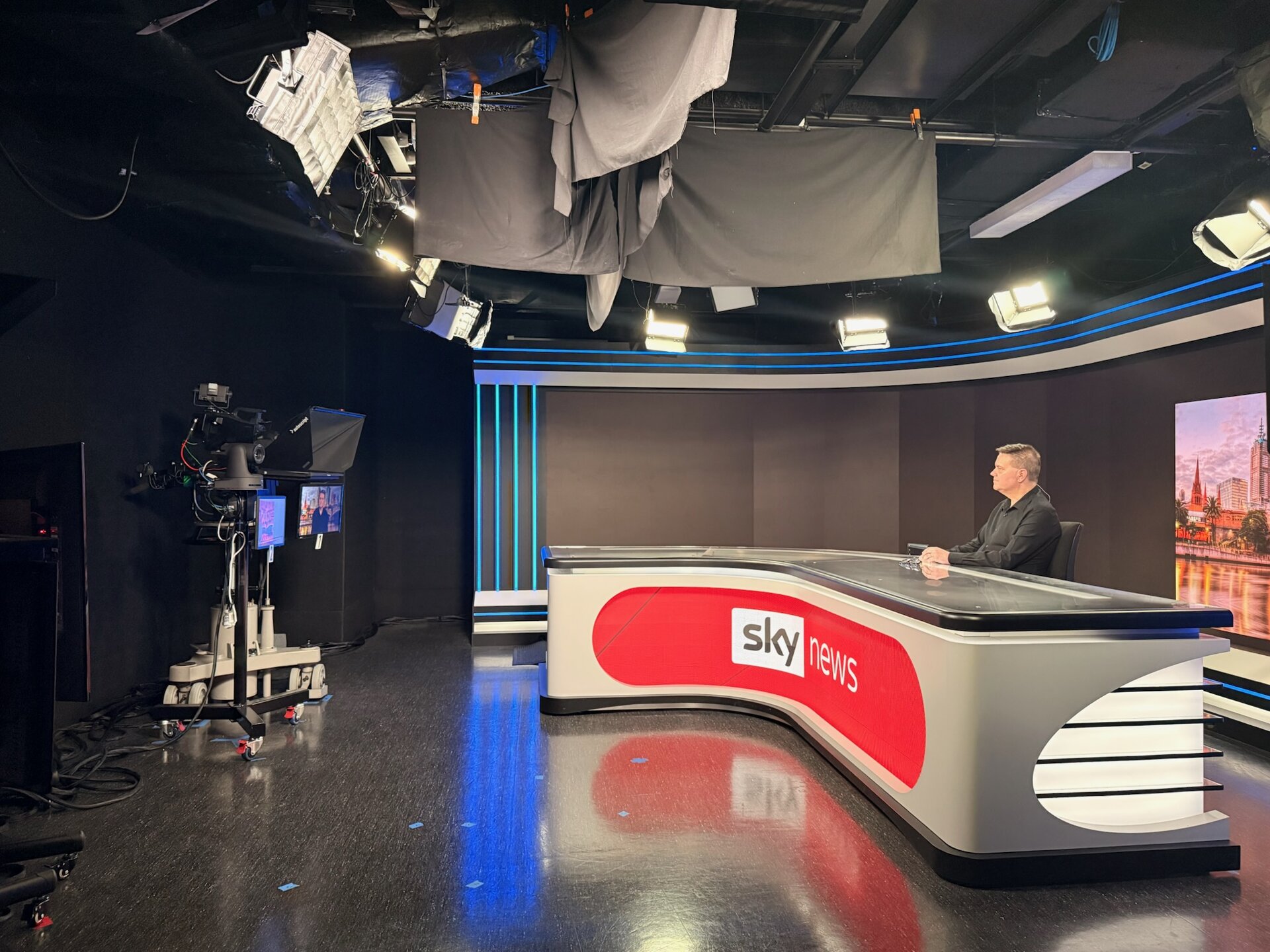 Mark Vos at the Sky News studio desk, Melbourne